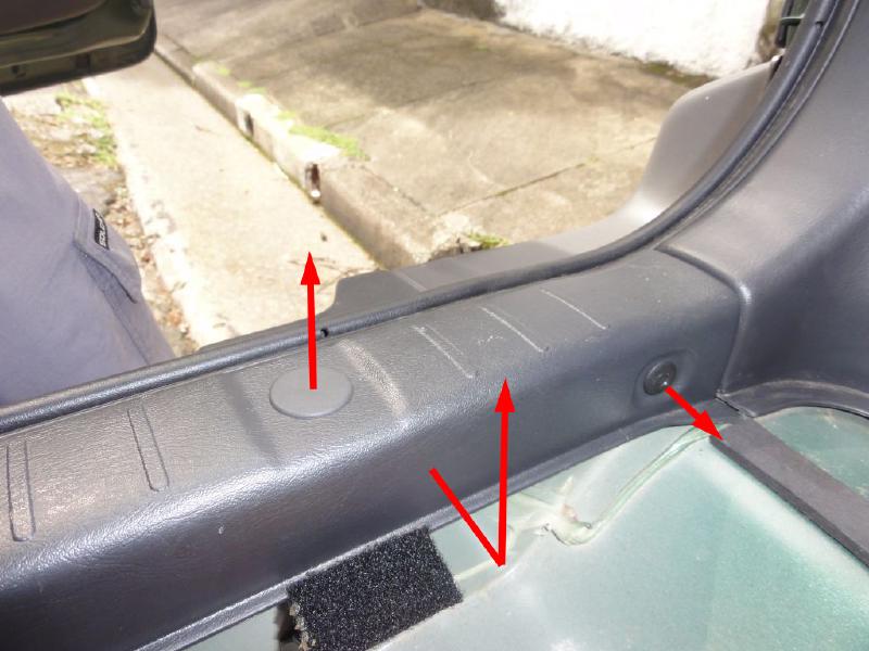 Remove the back trim. Release the clips as indicated in the next picture and pull this part out. Don&rsquo;t use any tools, be gentle. Before removing it completely, take a look in the way the rubber finish covers this part. You&rsquo;ll need to remember that when assembling it back.
