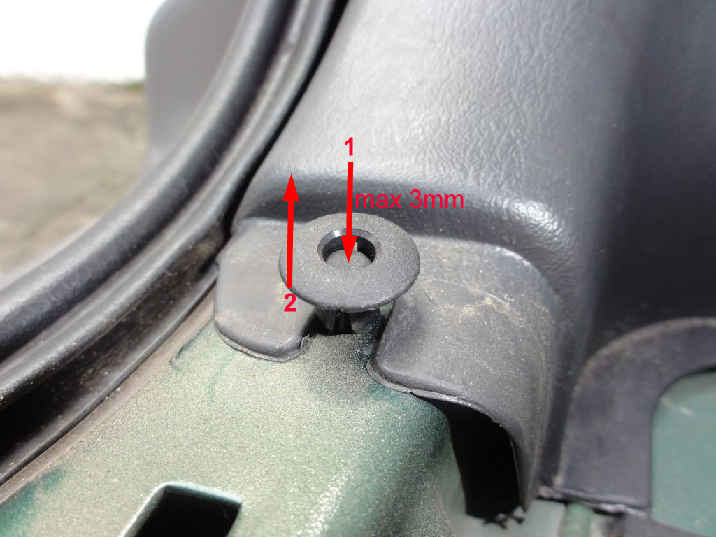 To unlock this clip, push the center about 2 or 3mm and then lift the entire piece. Don't push more than 3mm otherwise you'll lose the center pin inside your car body. The clip from this picture can be seen after you remove the back trim.