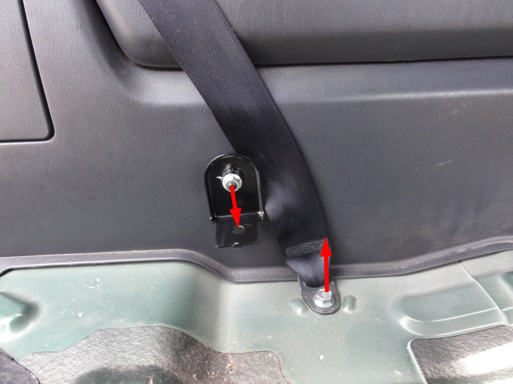 Remove the pivot holding bolt (13mm hex). Loose the rear seat belt screw. NOTICE: Remember to tighten this screw after assembling the trims and before installing the seats.